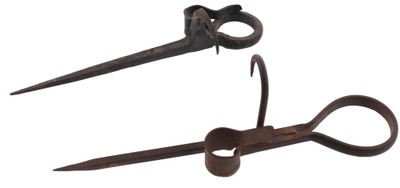 Unmarked: Two "Sticking Tommy" Candle Holders